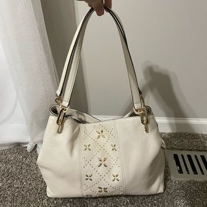 Michael Kors pebbled leather with floral pattern accent. White. Magnetic snap.